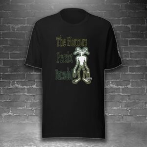 image feature a t-shirt with the image of a frog next to the words the horrors persist but so do i, against a gray brick background