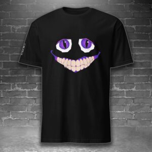 image feature a t-shirt with the image of a smiling creature against a gray brick background